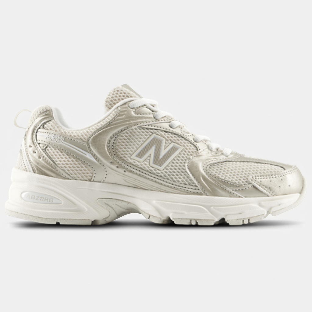 New Balance 530 Gold Metallic Linen — vista superior New Balance 530 Gold Metallic Linen visto de cima, com etiqueta dourada na língueta