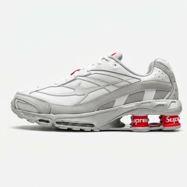 Nike Shox Ride 2 Supreme White com tecnologia Nike Shox, mesh respirável e acabamento branco premium.